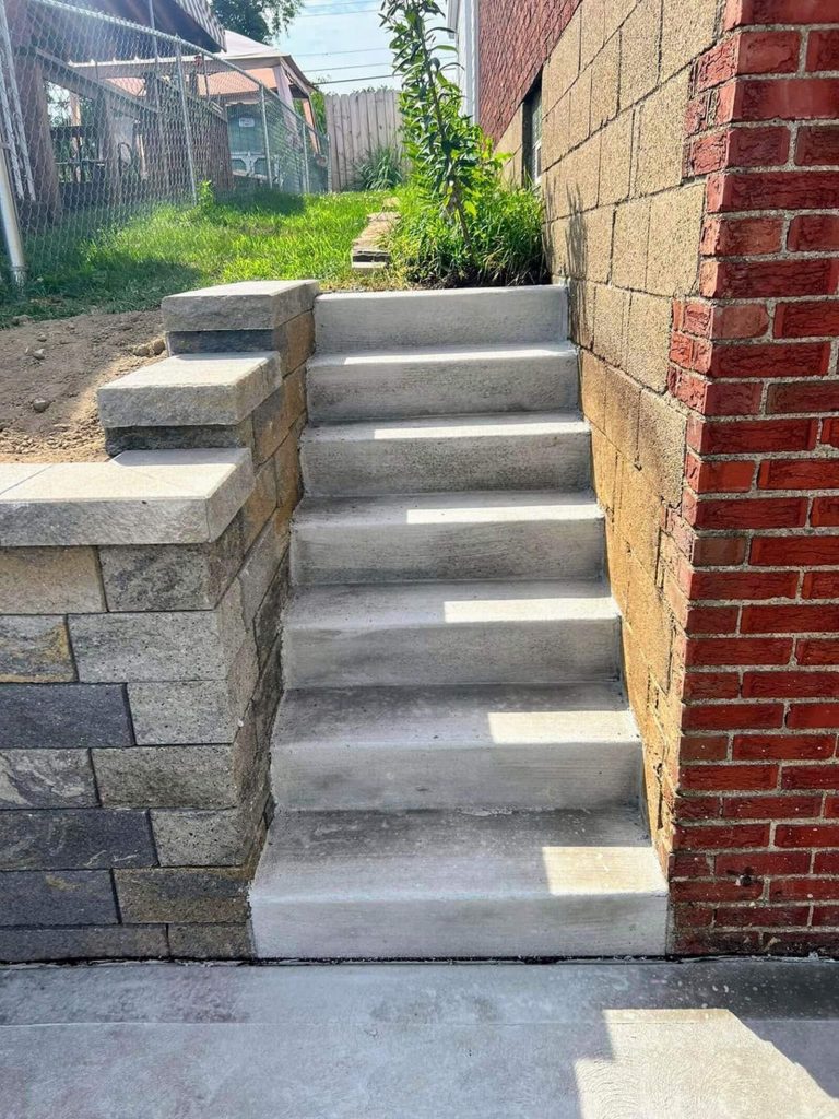 Retaining wall and concrete stair installation in Pittsburgh PA hillside property