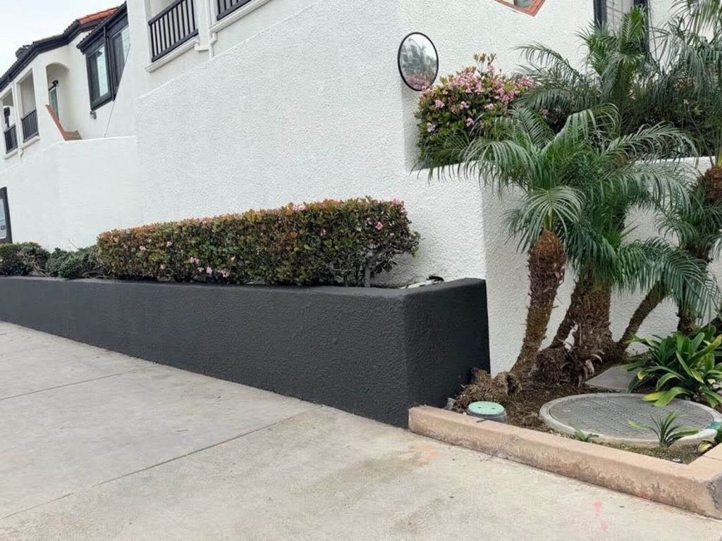 Landscape retaining wall improving usable outdoor space in Orange County