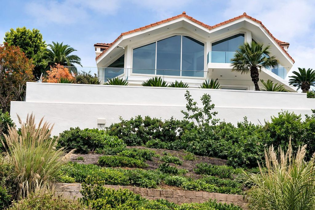 Hillside retaining wall supporting a custom San Diego residence