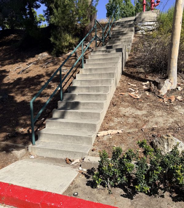 Retaining wall and concrete staircase installation on a steep Los Angeles hillside